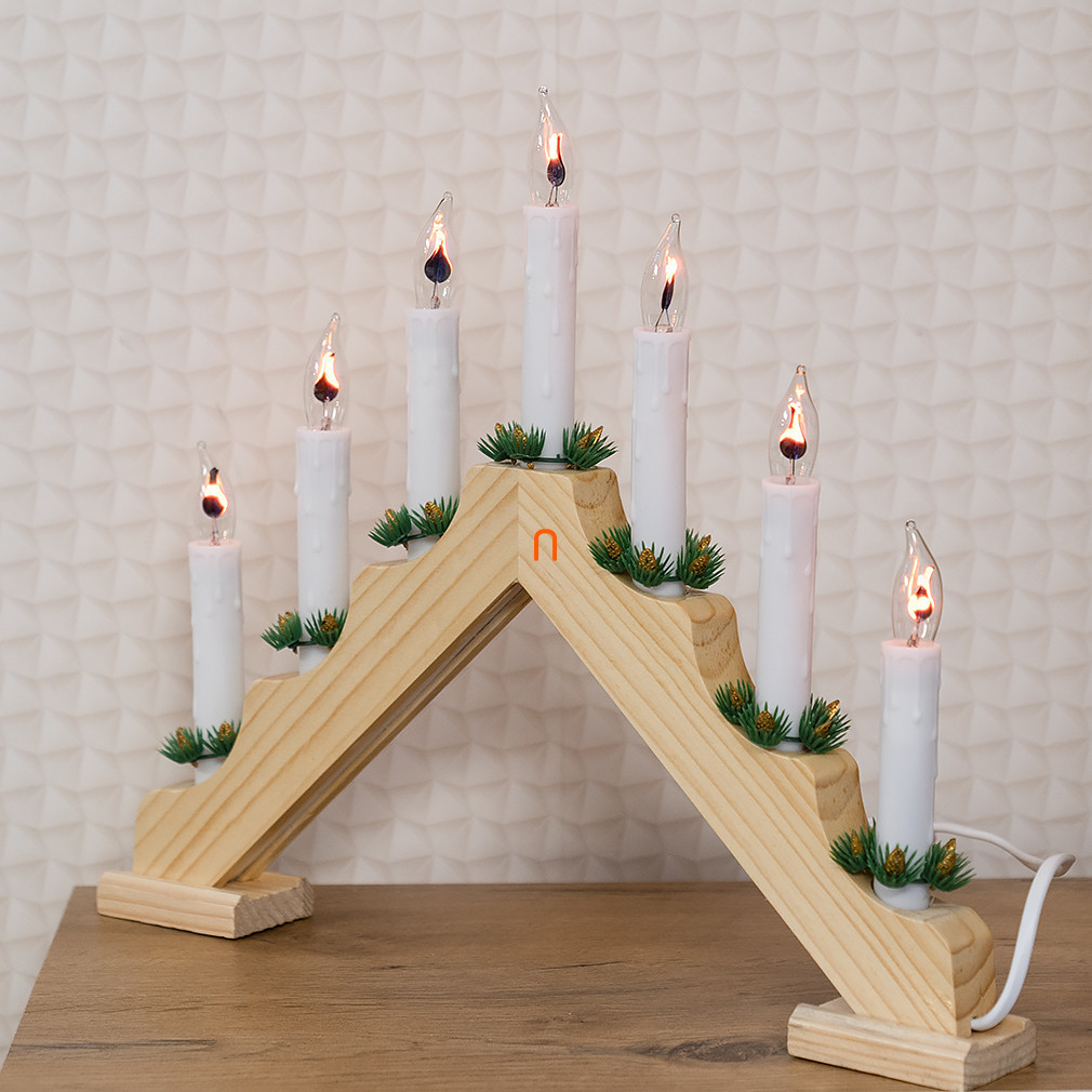 Pyramid of candles with red flame, wood